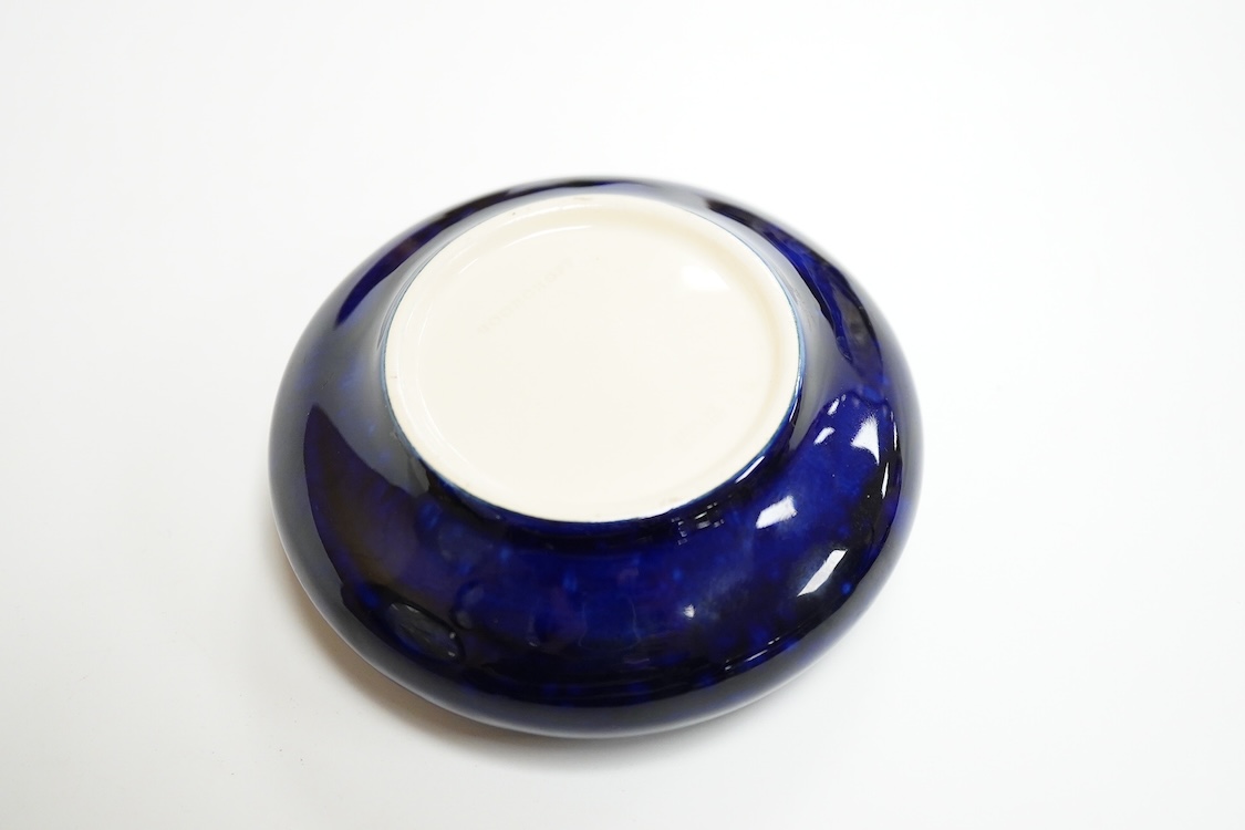 A small Moorcroft bowl in the anemone pattern, stamped to the base, 11cm in diameter